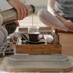 A peaceful tea ceremony with a focus on mindfulness and meditation, captured indoors.